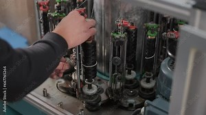 Vertical high-speed modern braiding machine. Equipment for making braids from metal wire.