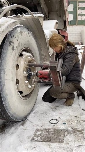 Female heavy truck mechanic works hard in the snow and rain #viral #female #snow #rain #workhard