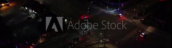 Red blue flashing lights of police cars blocking traffic, Brampton Civic Hospital fire alert, high angle night aerial view