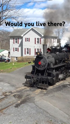 Everett 11 sneaks by an old farmhouse #train #railroad #steamtrain #railroadhistory #railfanning