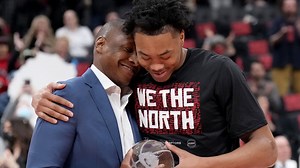 Scottie Barnes gets his Rookie of the Year award from Masai Ujiri