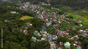 Aerial view of Sagada village, located in the mountainous province of Philippines. Houses and streets of a mountain town.