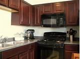 Photos of Black Stainless Appliances With Cherry Cabinets