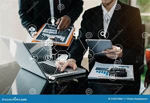 Businessman And Partner Using Laptop And Calculator For Calculation