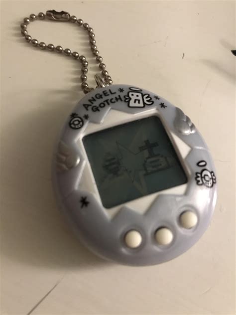 Cleaning the Buttons of a Tamagotchi Device