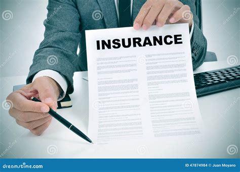 person holding insurance policy