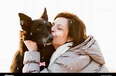 dog kissing woman stock alamy mid close adult her