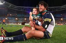 thurston johnathan nrl daughter australia getty rugby grand final frankie his top cowboys captain moment takes centre field captivated doll
