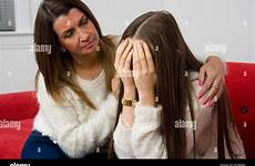 mother comforting sad her daughter teenage alamy
