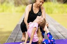 daughter exercises gymnastic perform mom sunny bridge morning wooden summer park