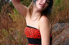 beautiful young woman girl dress stock red posing rocks