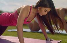 girl pushups doing ups asian push woman exercise fitness outdoor closeup pushing sporty sunny strong training park fit