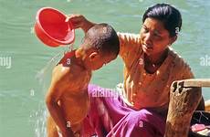 myanmar bathing son woman riverside dein inle burma alamy lake