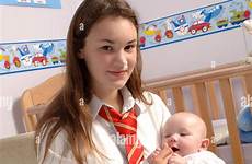 baby holding teenage her alamy nursery schoolgirl