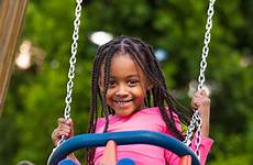 playground swing girl playing kids outdoor cute safety stock school african equipment portrait look children play summer into young birminghamtimes