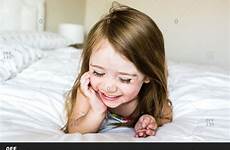 little bed offset lying girl giggling questions any