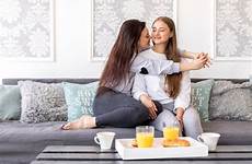 lesbian sofa couple tender sitting breakfast