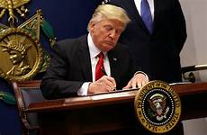 trump president travel ban donald executive order signed travelers does do imposing tighter entering vetting friday wsj trumps