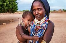 breastfeeding tribe africa woman baby ethiopia her erbore ethiopian feeding mother premium istock getty