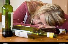 drunk blonde woman bottles alcoholic alcohol young empty alamy