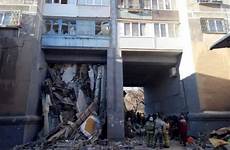 building after rubble under blast russia reports dead alive hours found boy baby three collapses rise least high spending than