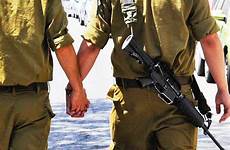 gay soldiers viral hands holding two idf going