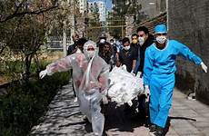 iran riot coronavirus outbreak worst amid prisoners region victim infected protective carry died wearing being clothing body after who people