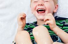 feet tickled laughing hysterically child stock tickle getting while alamy toes tickling baby man