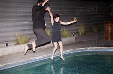 pool clothes jumping wearing party into couple dissolve stock cavan d1061