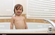 bath girl toddler water tub smiling alamy coming