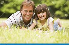 outdoors father daughter lying flowers length preview camera