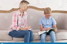 sofa shirt female plaid notebook tutor sitting notes boy making young his blue her preview