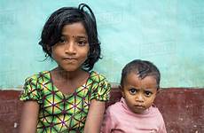 sit bangladeshi brother sister front their house sylhet dissolve stock d1301