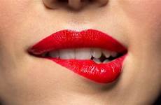 lip biting woman girl her mean red does bites when mouth lips lipstick close finger body she lower bit expression