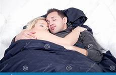 couple sleeping peacefully bed young arms each others contented serene clasped expressions stock royalty