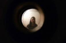 peephole peeping woman