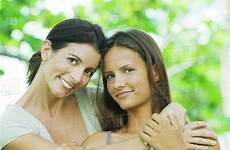 daughter mother teen embracing smiling portrait both camera stock dissolve royalty d984