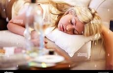 asleep drunk girl woman alamy young stock drinking sofa after blonde alcohol