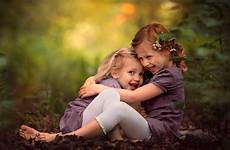 sisters hugging cute 4k sitting other smiley blur dry leaves each green background wallpapers wallpaper resolutions 2160 ultra