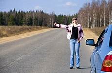 car girl stopping hitchhiking woman stock