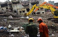 bangladesh factory rescued collapse days woman after machinery workers personnel heavy army use work they ap garment dhaka victims collapsed