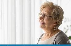 window looking woman elderly through preview