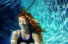 underwater girl swimming hair pool red teenage dissolve stock d145