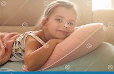 girl little napping couch camera lying bed looking happy stock happiness preview