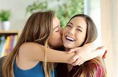 kissing girl affectionate friend her sister dreamstime preview