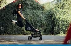 baby stroller jumping pushing joy mother happy