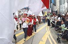 hong kong may humanitarian became tsunami maids caught rally migrants workers mark during march