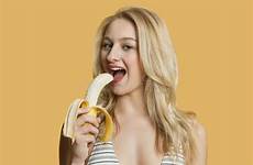 banana eating woman beautiful benefits blond colored portrait background over mustard seeds daily uses skin health hair person preview