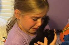her girl kitten little kitty surprised breaks arms cradled thrilled rescue she who down