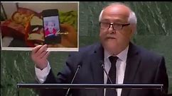 巴勒斯坦代表在联合国手举加沙儿童照片哽咽发言